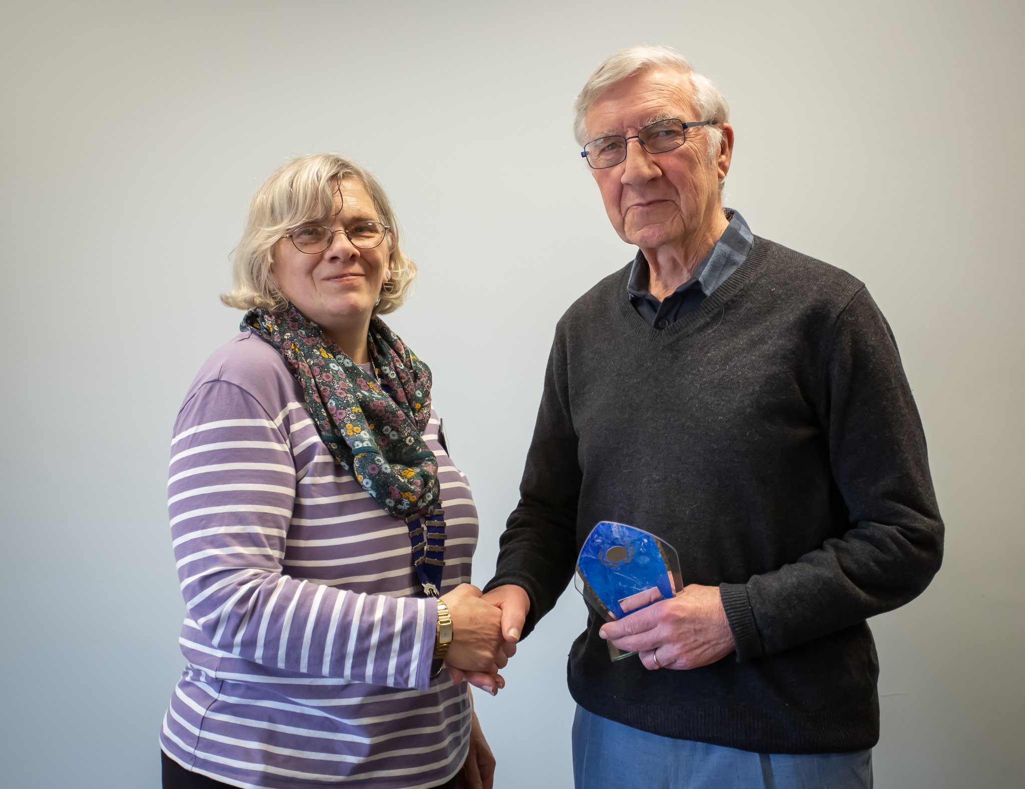 image of Tony Cole being presented with the DPIC Small Clubs' Trophy by Helen Jones