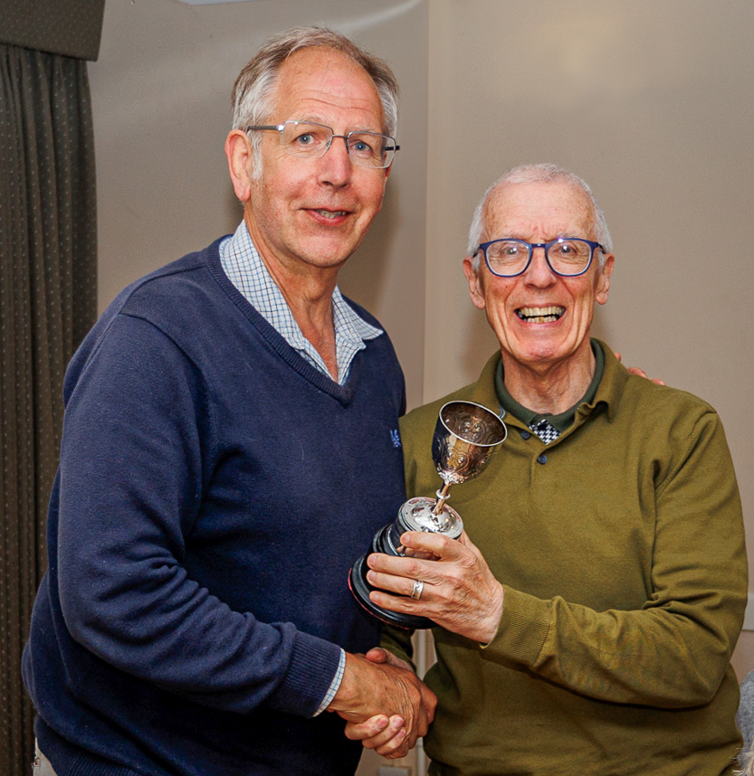 Brian being presented with a trophy by new Chairman, Adie