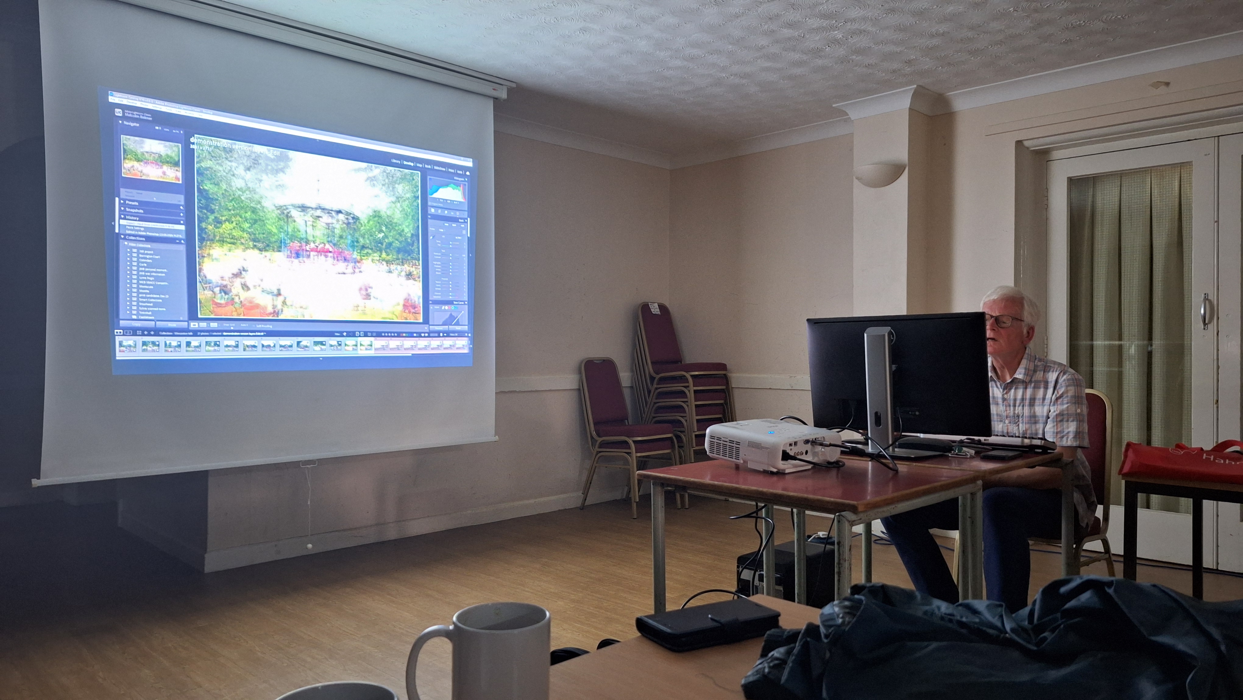 Malcolm Balmer demonstrating his photography from the computer